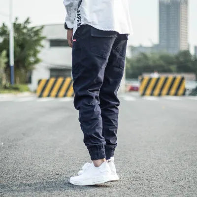 Mid-waist slim-fit cotton harem trousers with feet in black, size M, shown front view