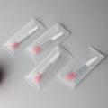Crystal rod lip brush with man-made fibre bristles, 9cm total length, red colour, on white background