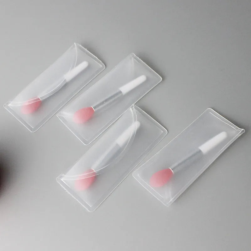 Crystal rod lip brush with man-made fibre bristles, 9cm total length, red colour, on white background