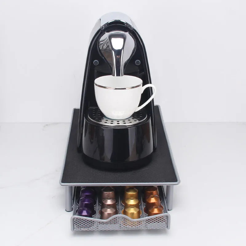 Iron coffee capsule drawer holder in sprayed silver grey on a kitchen worktop