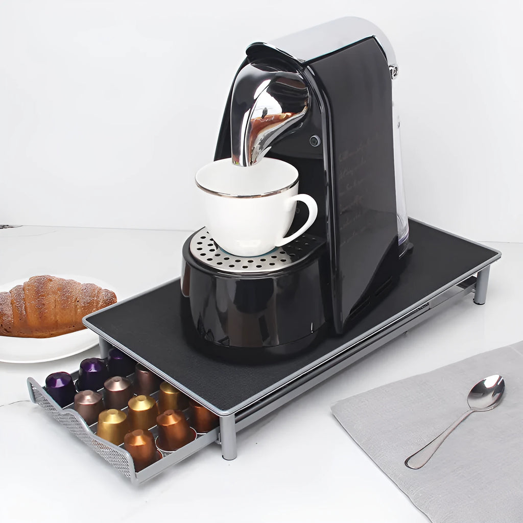 Iron coffee capsule drawer holder in sprayed silver grey on a kitchen worktop