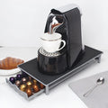 Iron coffee capsule drawer holder in sprayed silver grey on a kitchen worktop