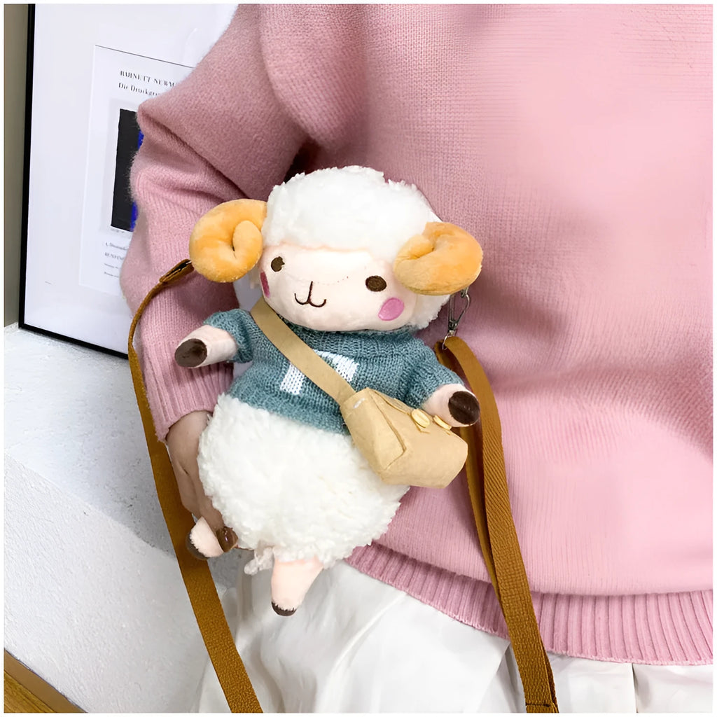 Soft blue plush crossbody bag with a lamb pattern, showing zip opening and shoulder strap.