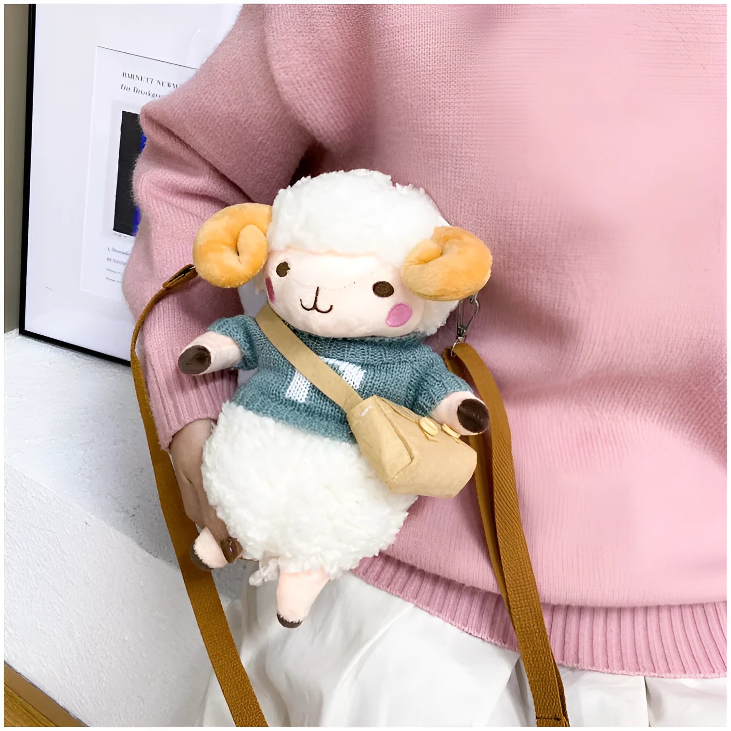 Soft blue plush crossbody bag with a lamb pattern, showing zip opening and shoulder strap.