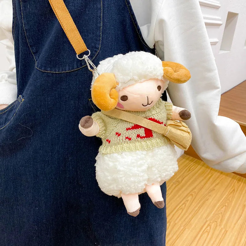 Soft blue plush crossbody bag with a lamb pattern, showing zip opening and shoulder strap.