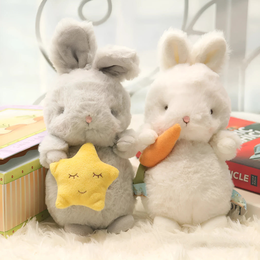 Soft fluffy angora rabbit plush toy in grey with carrot design, 23cm tall on white background