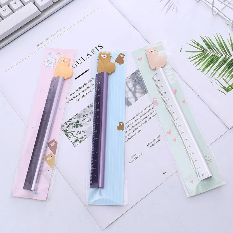 Colourful alpaca design printed on a silver 20 cm aluminium straight ruler.