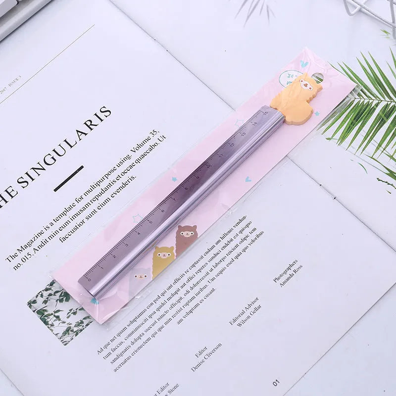 Colourful alpaca design printed on a silver 20 cm aluminium straight ruler.