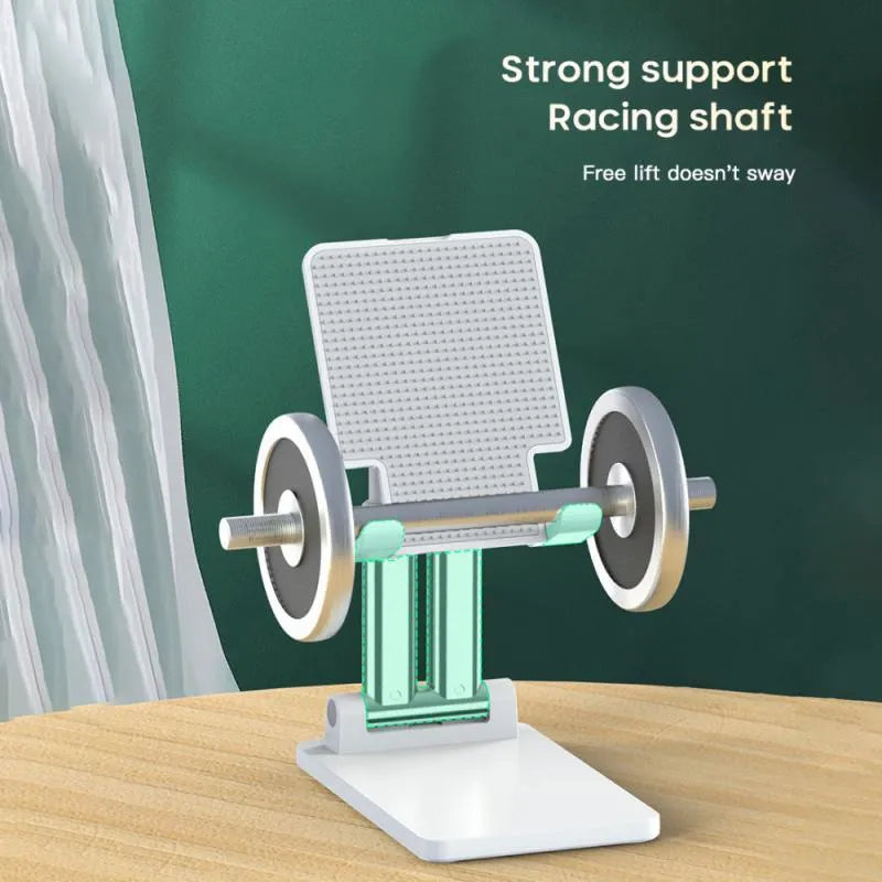 Black universal adjustable dual-rod phone bracket mounted on a desk edge, holding a smartphone.