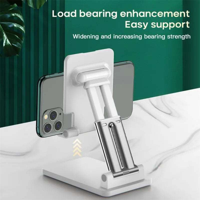 Black universal adjustable dual-rod phone bracket mounted on a desk edge, holding a smartphone.