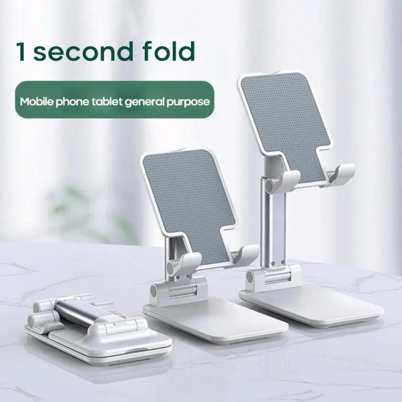 Black universal adjustable dual-rod phone bracket mounted on a desk edge, holding a smartphone.