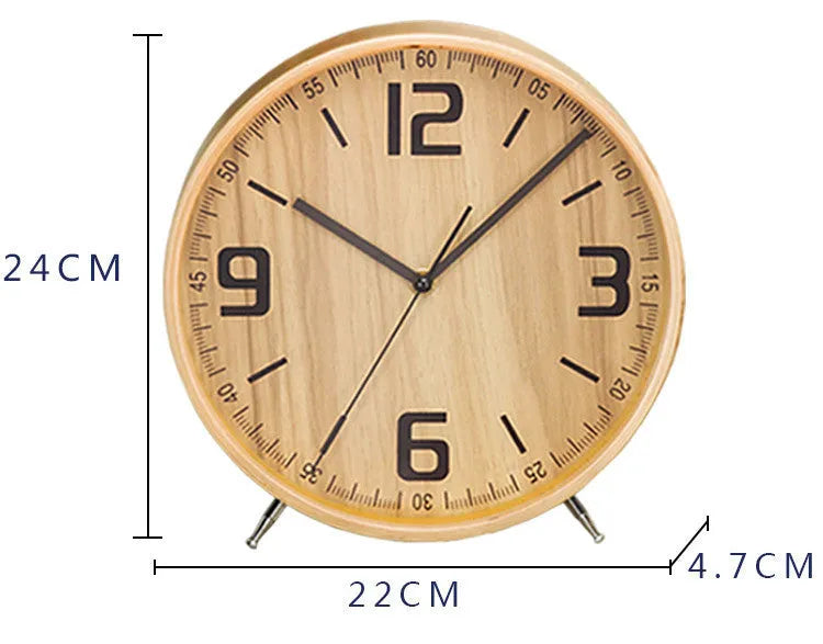 Round wood quartz table clock with sweep second movement in green finish on a wooden surface