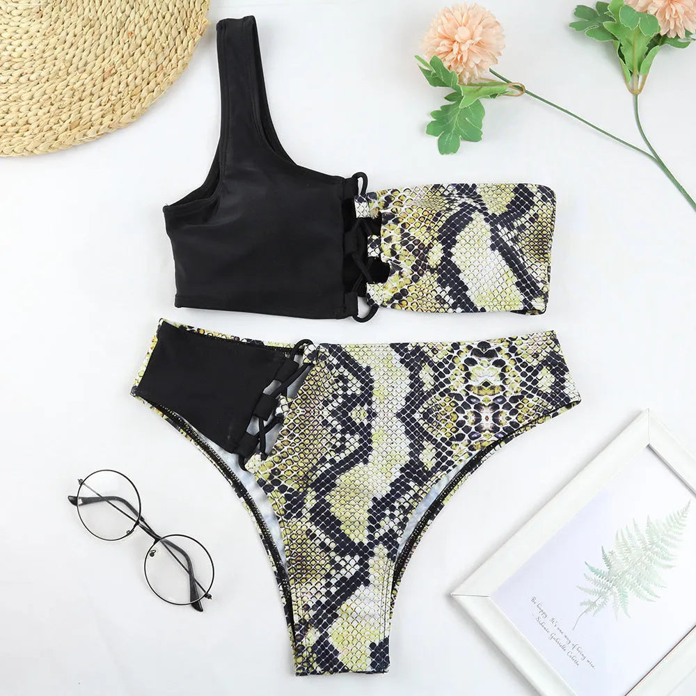 Ladies one shoulder leopard print split swimsuit with removable chest pad, side view on model