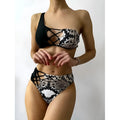 Ladies one shoulder leopard print split swimsuit with removable chest pad, side view on model