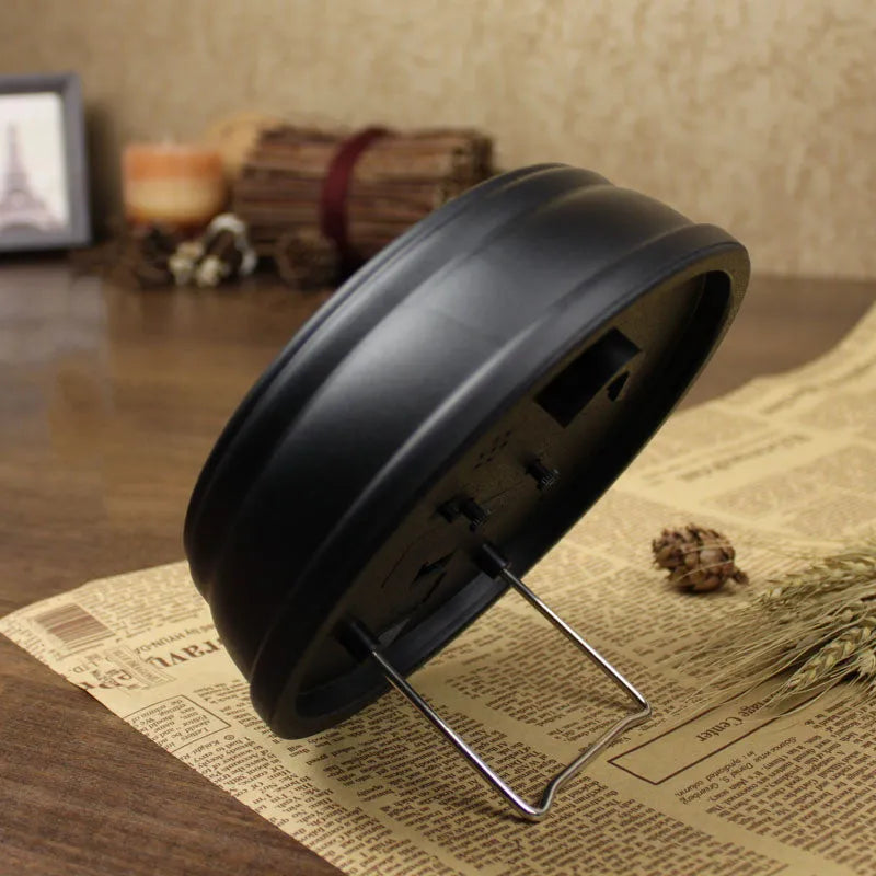 A round 6-inch retro European style desk alarm clock with a silent sweep movement on a wooden surface.