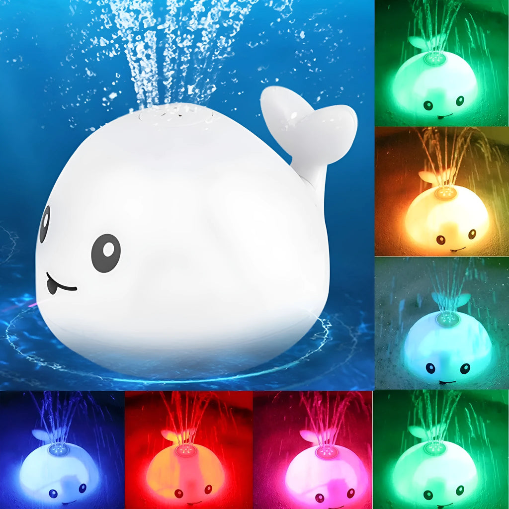Grey and white whale bath toy spraying water with LED lights on water surface