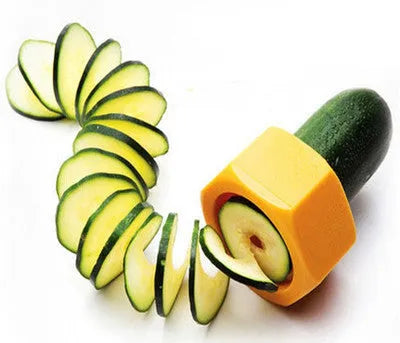 Yellow and green plastic spiral vegetable cutter and cucumber slicer kitchen gadget.