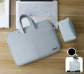 Navy blue waterproof PU leather laptop bag open, showing padded computer pocket, tablet sleeve, and internal organisers.