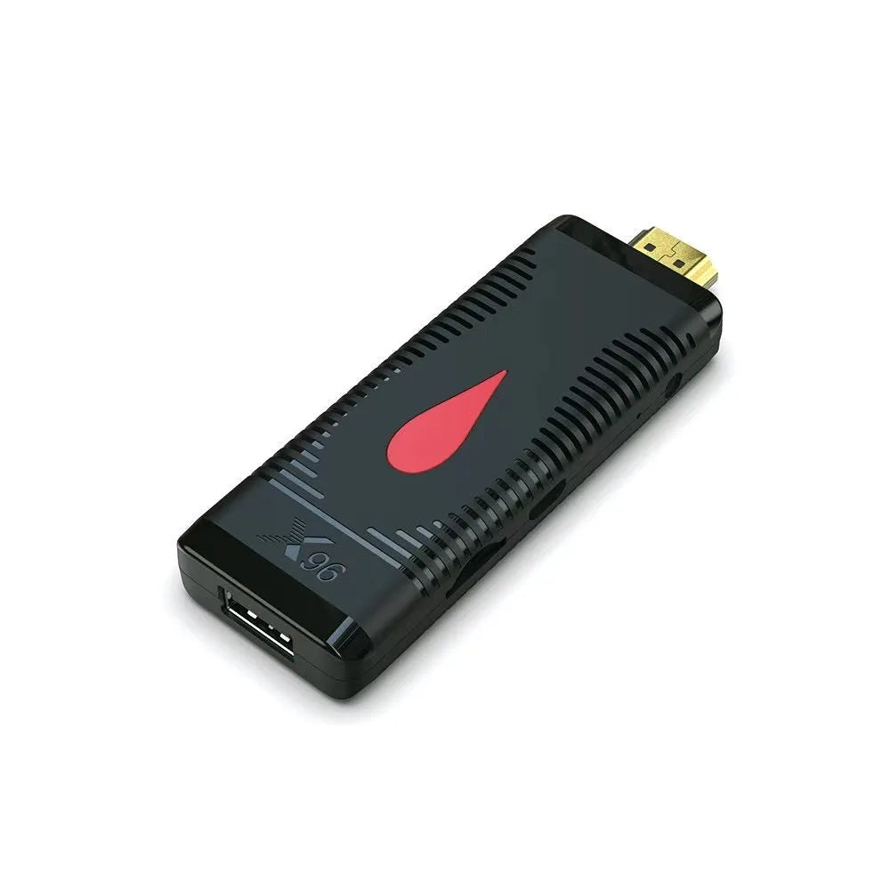 Smart network TV set-top box dongle with remote control, HDMI cable, and power supply.