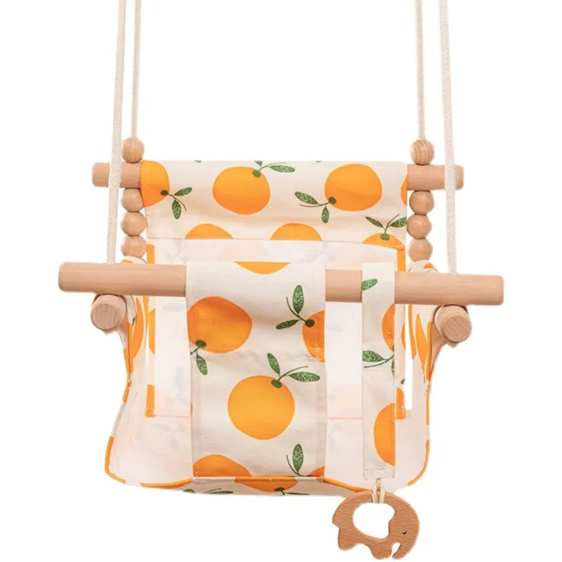 Cotton canvas baby swing chair with wooden seat and cushion hanging indoors
