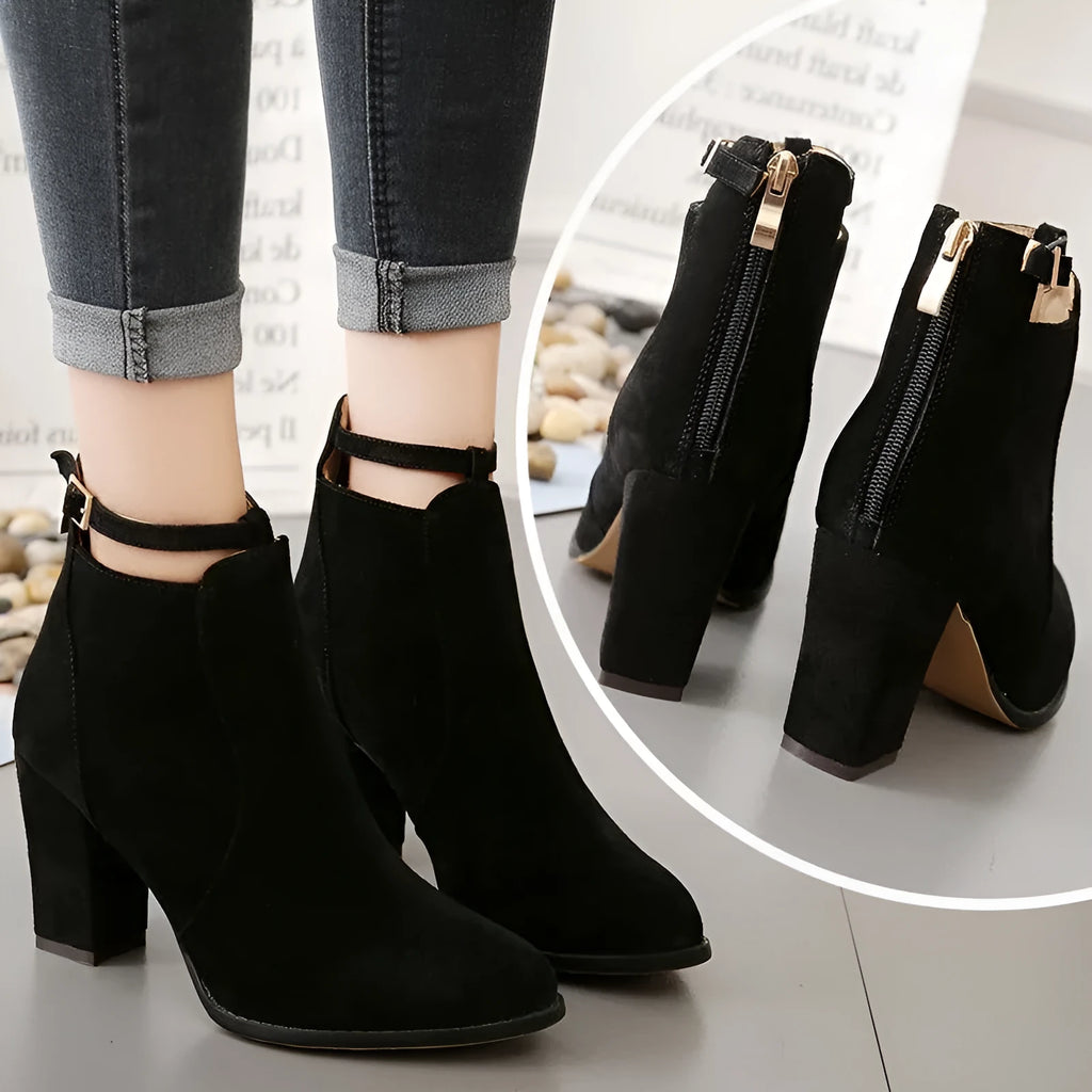 Women's high-heeled Martin boots in black with belt buckle detail, low tube, round toe, and faux fur lining
