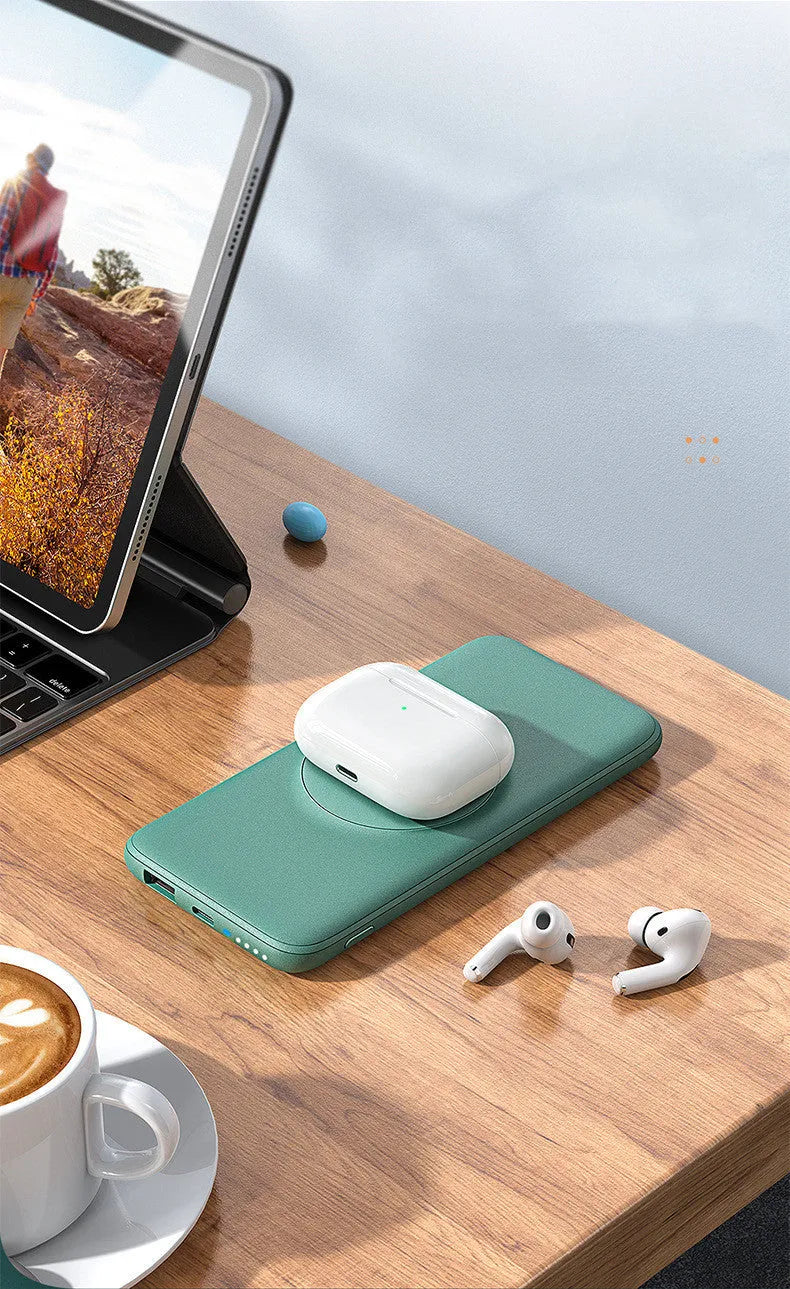 Mint green Maiduo Magsafe magnetic wireless power bank with back clip attached to an iPhone