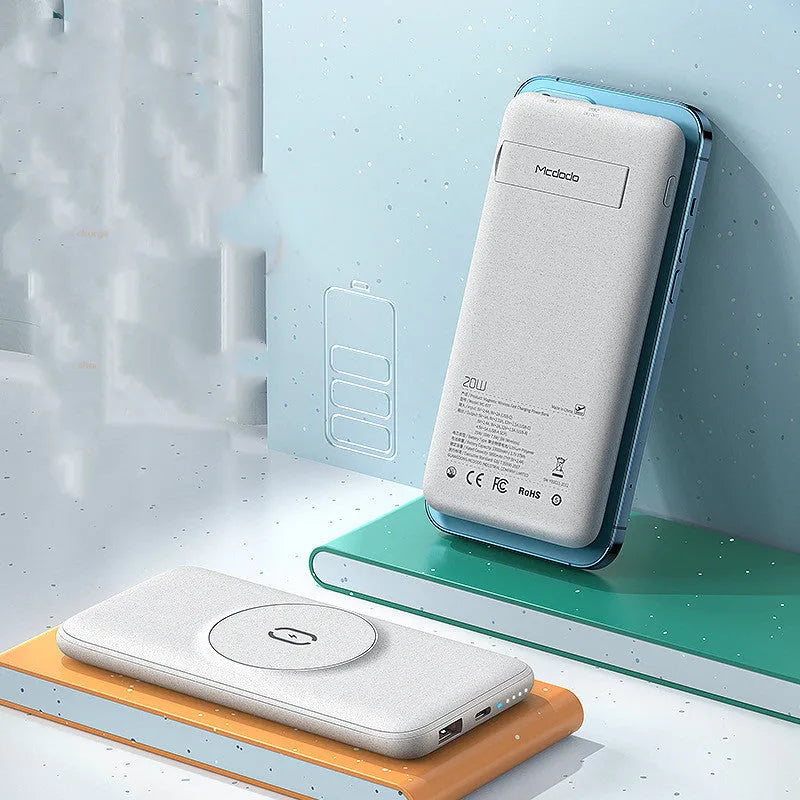 Mint green Maiduo Magsafe magnetic wireless power bank with back clip attached to an iPhone