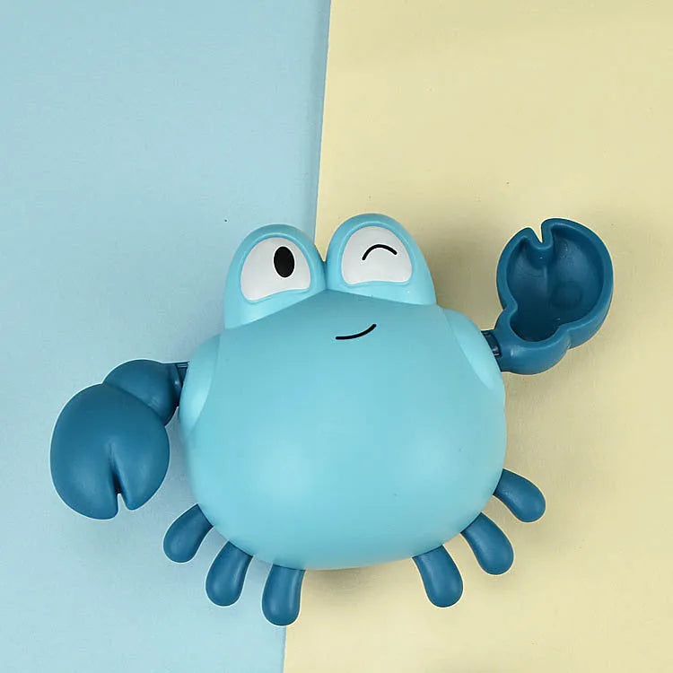 Clockwork crab and turtle bath toys floating on water – pink and blue options