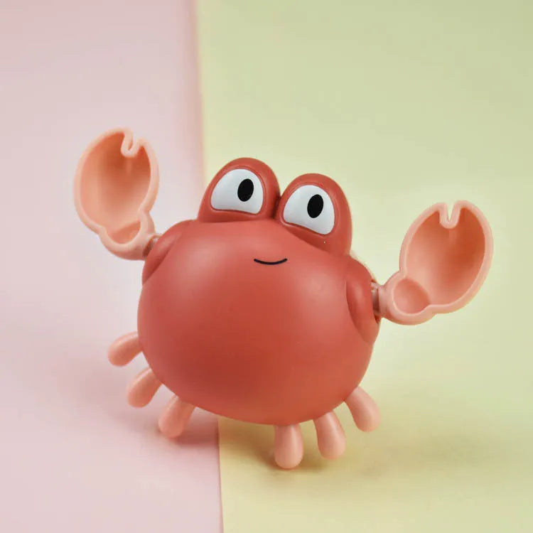 Clockwork crab and turtle bath toys floating on water – pink and blue options