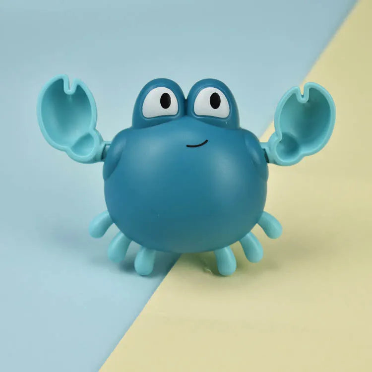 Clockwork crab and turtle bath toys floating on water – pink and blue options