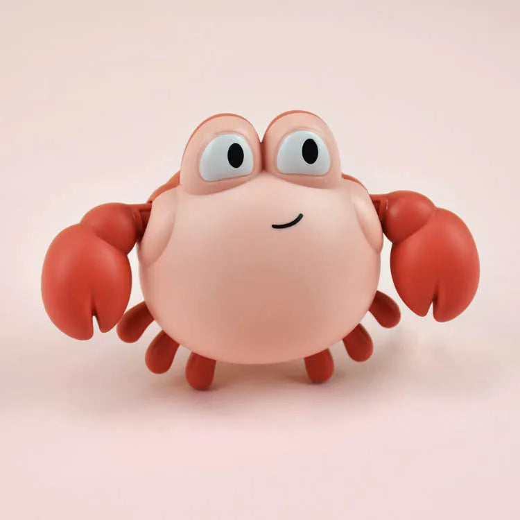 Clockwork crab and turtle bath toys floating on water – pink and blue options