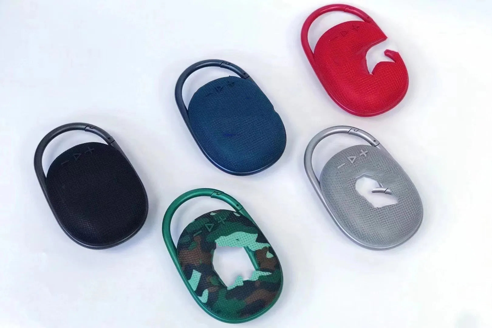 Compact portable Bluetooth speaker in one of six colours: pink, blue, black, red, silver grey, or green.