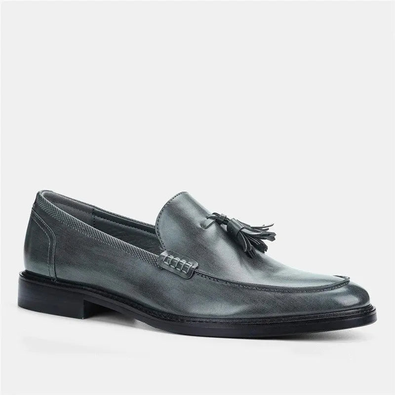 Brown PU leather men's loafers with tassel detail on a round toe, low-cut profile, grey background