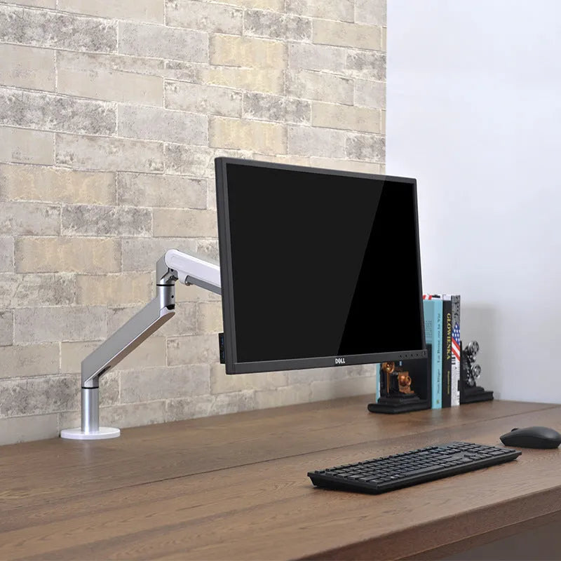 Adjustable lifting computer stand in dark grey supporting a monitor on a desk