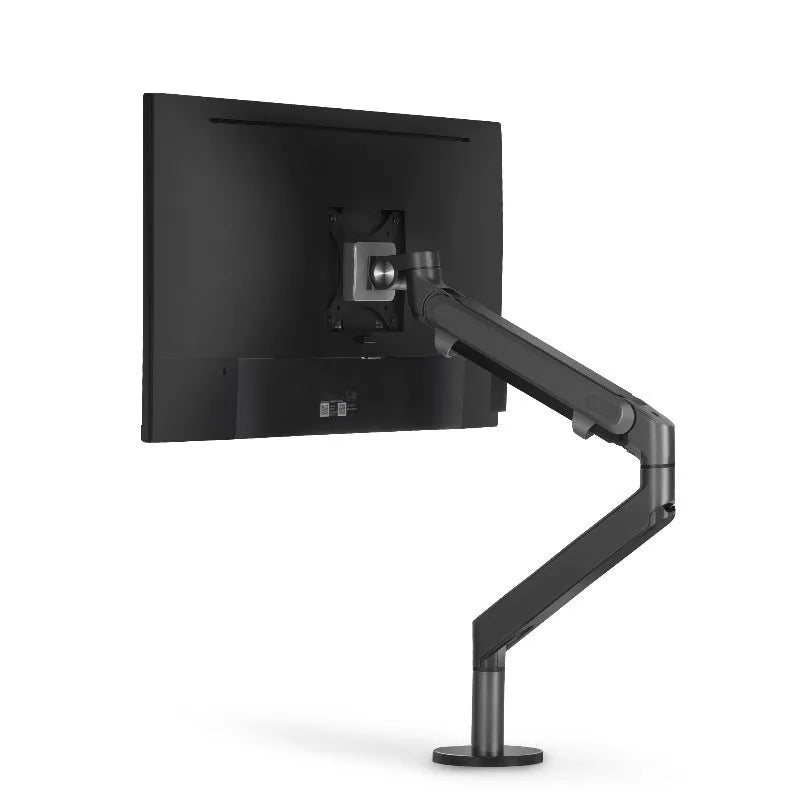 Adjustable lifting computer stand in dark grey supporting a monitor on a desk