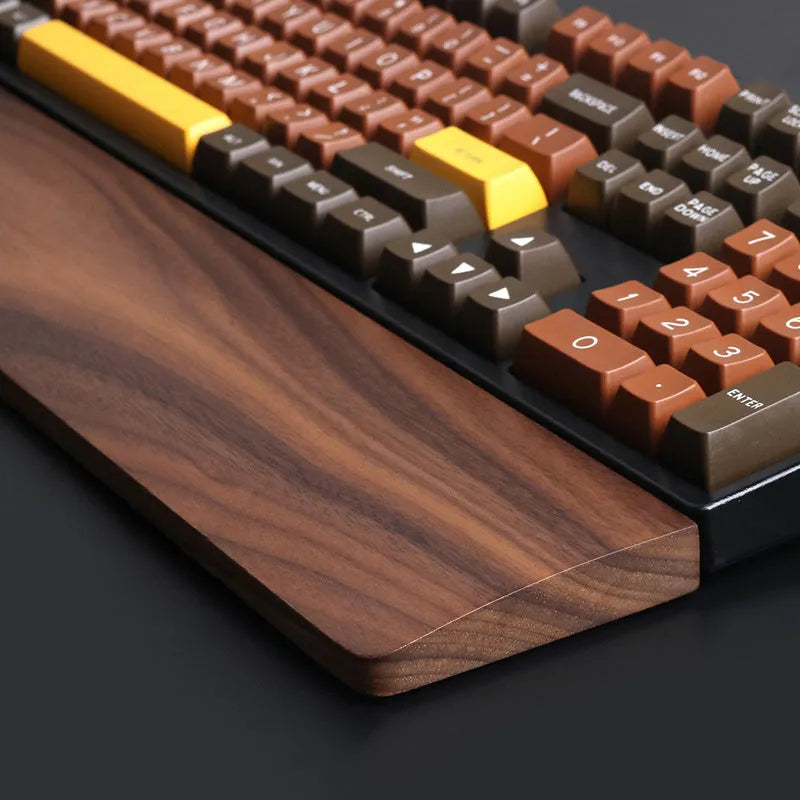 Solid walnut wood mechanical keyboard wrist rest showing natural grain pattern