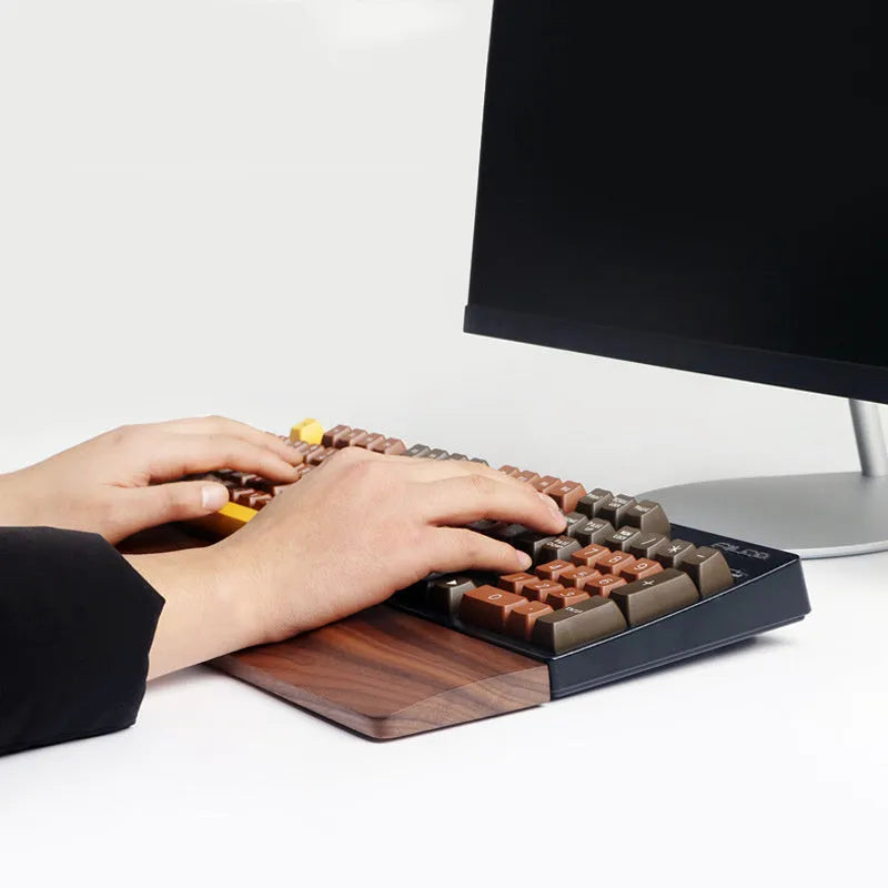 Solid walnut wood mechanical keyboard wrist rest showing natural grain pattern