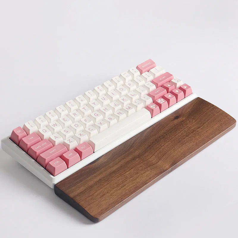 Solid walnut wood mechanical keyboard wrist rest showing natural grain pattern