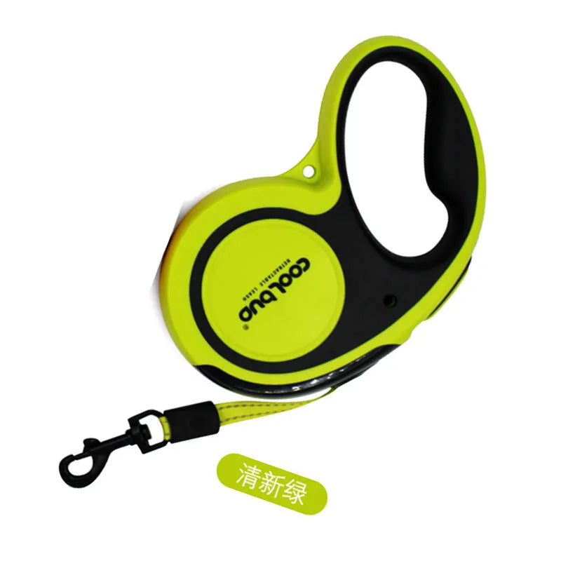 Retractable dog leash for large and medium dogs with green handle and black strap, on a grassy outdoor background