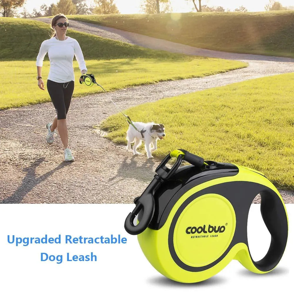 Retractable dog leash for large and medium dogs with green handle and black strap, on a grassy outdoor background