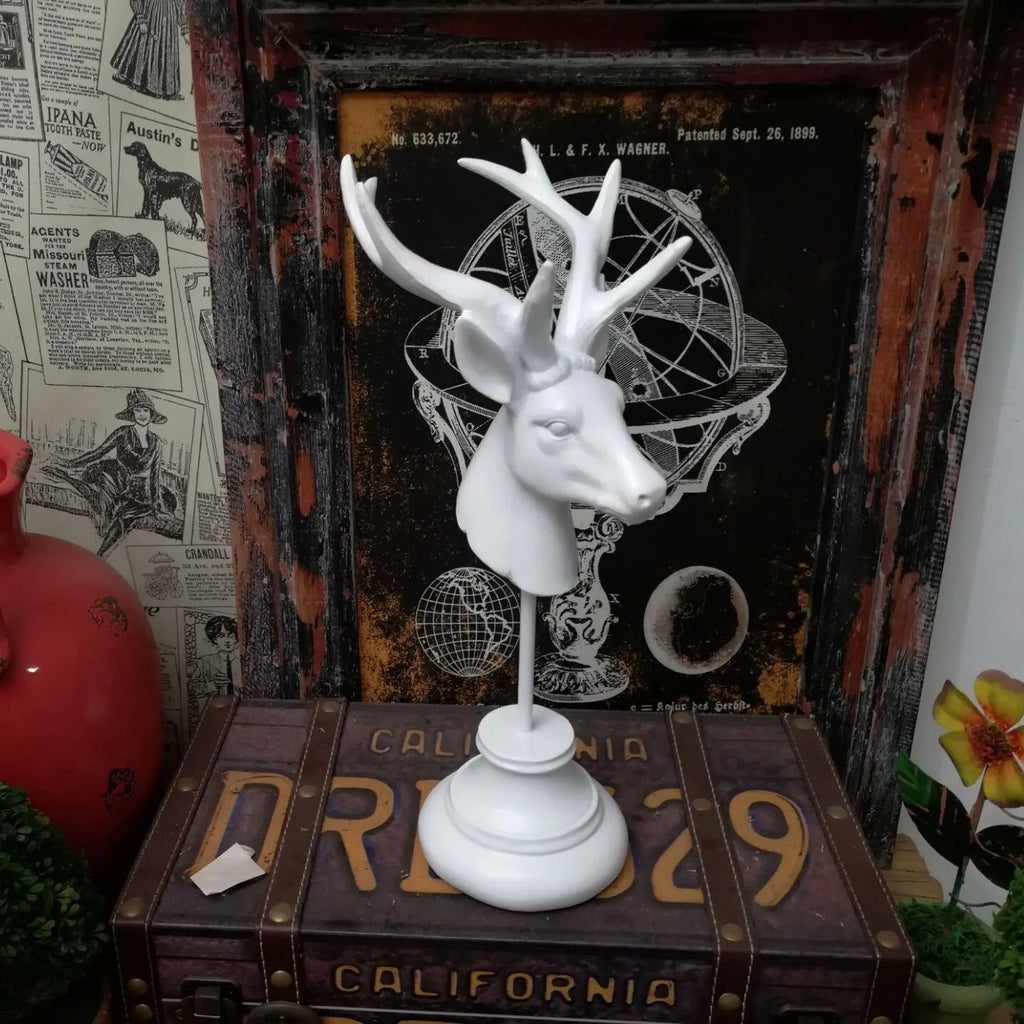 A detailed natural resin animal sculpture in black, white, or wood colour, measuring 32cm tall.