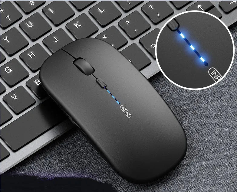 Ergonomic wireless mouse in silver gray with silent charging feature