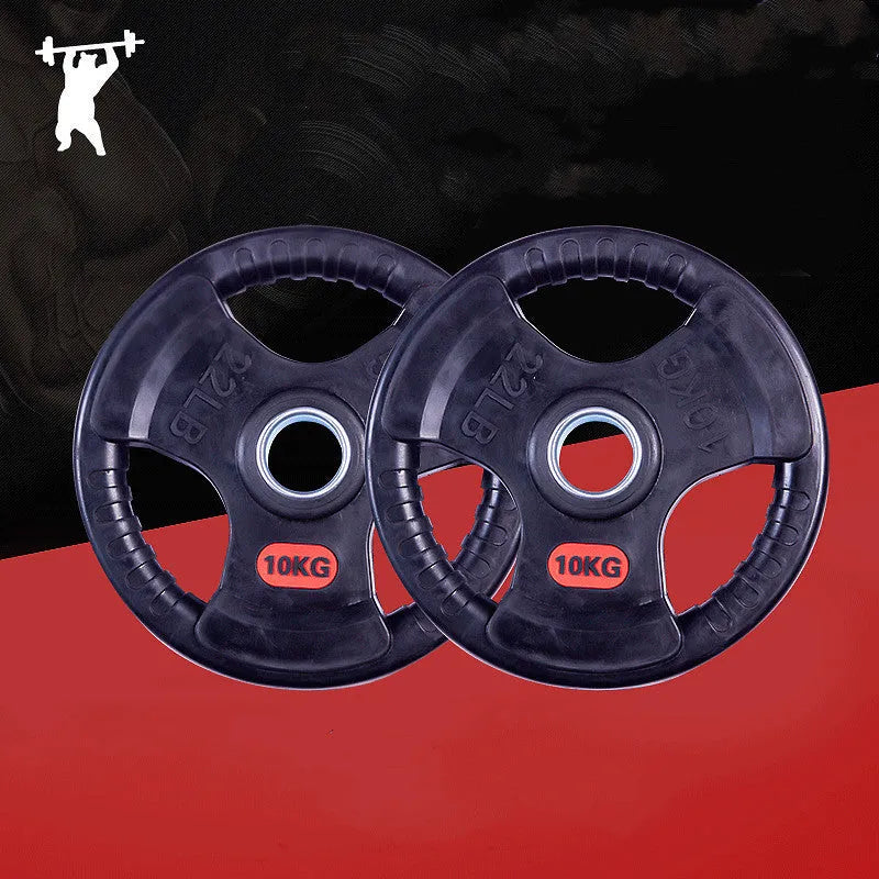Black cast iron barbell weight plate with rubber coating placed on a mat with a storage bag nearby
