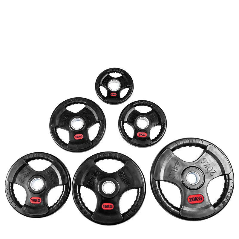 Black cast iron barbell weight plate with rubber coating placed on a mat with a storage bag nearby