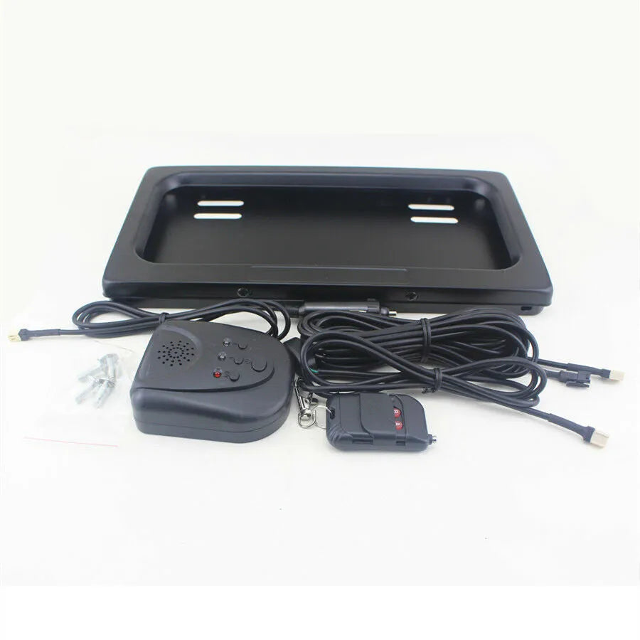 Black flipping licence plate frame made of iron and plastic measuring 314 by 169 millimetres, suitable for US standard plates