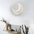 Modern round acrylic LED wall lamp in black or white, shown in small, medium, and large size options.