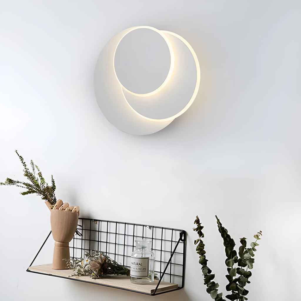 Modern round acrylic wall lamp in black or white, shown in three different sizes.