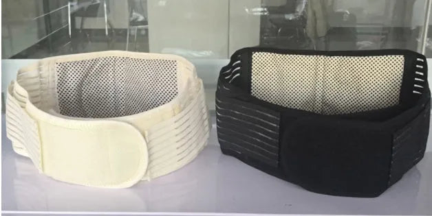 A black self-heating magnetic waist support belt, adjustable with a secure fastener, laid flat.