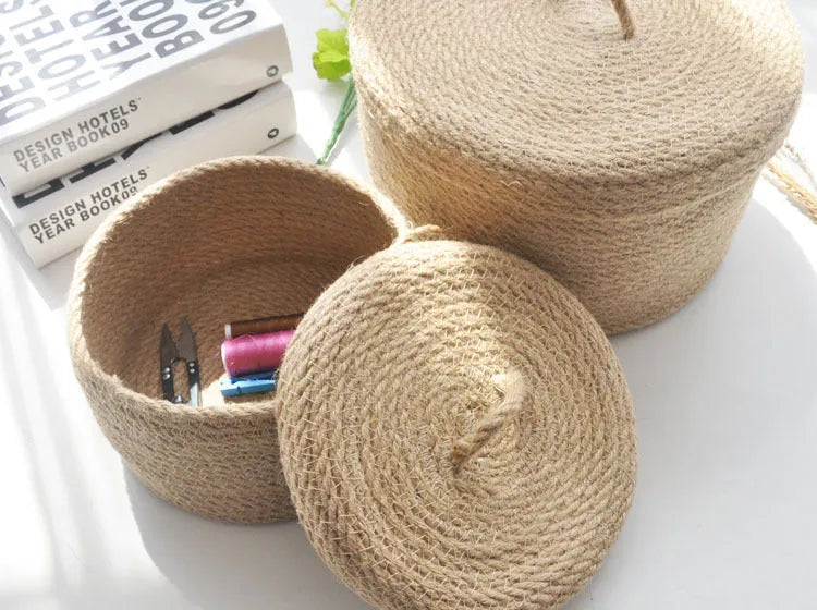 Japanese-style linen fabric storage basket with a cover on a tabletop, shown in three sizes.