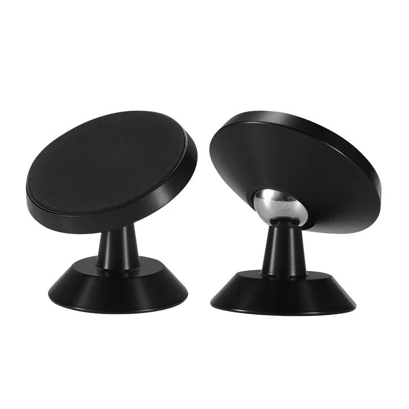 Black magnetic car phone holder mounted on dashboard with smartphone attached